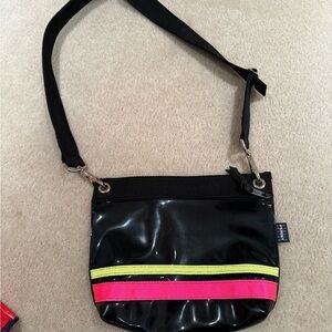 Ladies patent leather cross body bag black and hot neon pink
